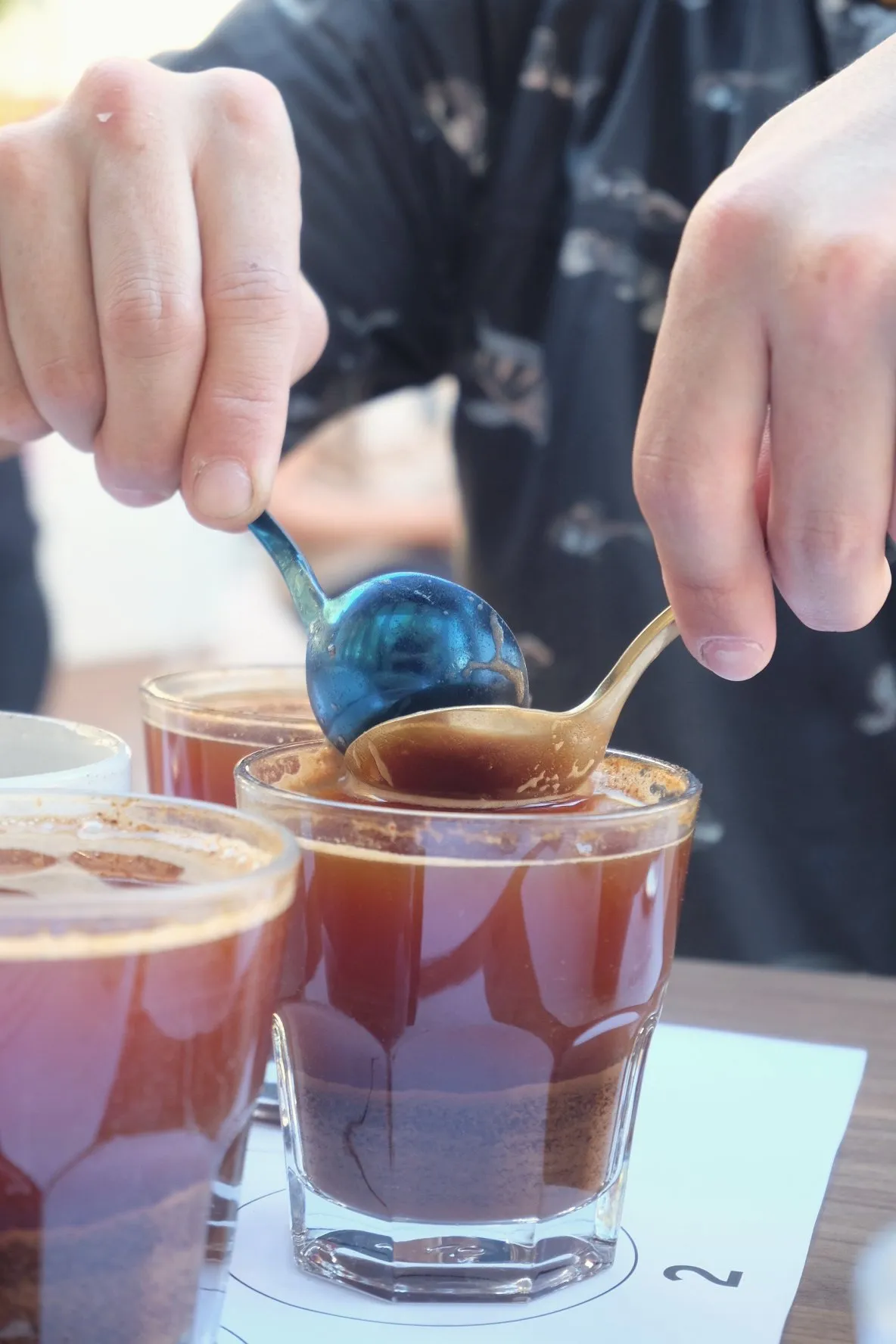 Breaking the crust during a coffee cupping
