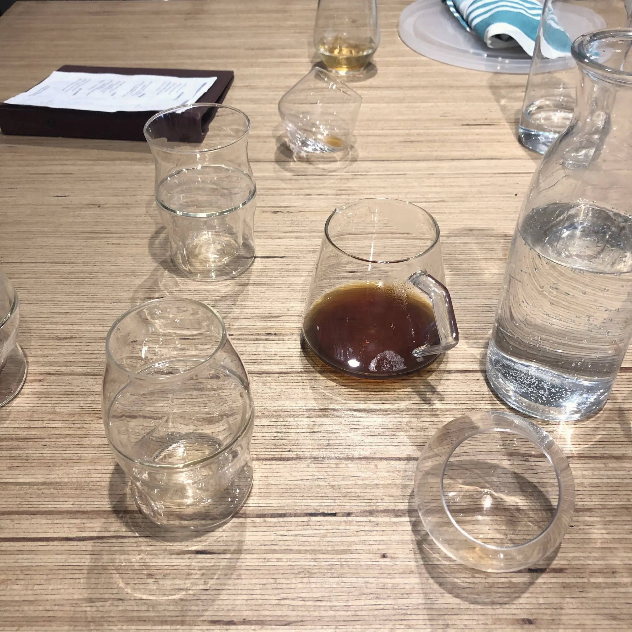 A coffee tasting flight in small glasses at a Sydney cafe