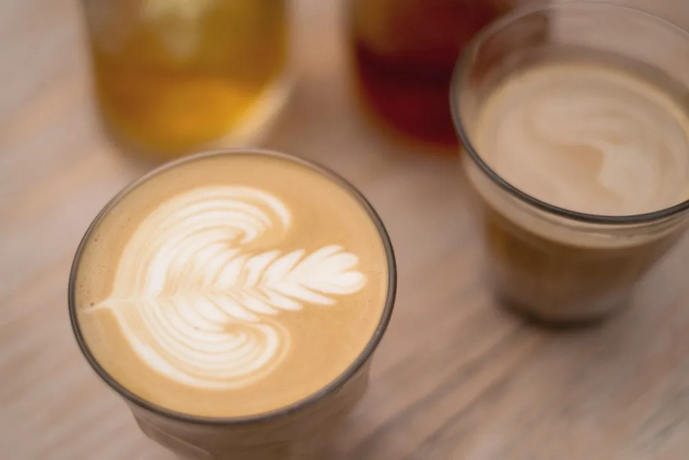 A flat white on a cafe table in Seoul