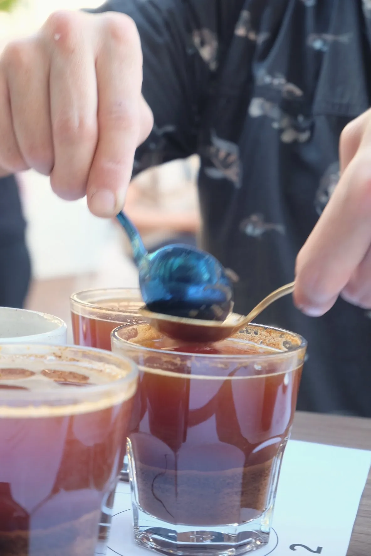 Iced coffee in glasses on an outdoor table