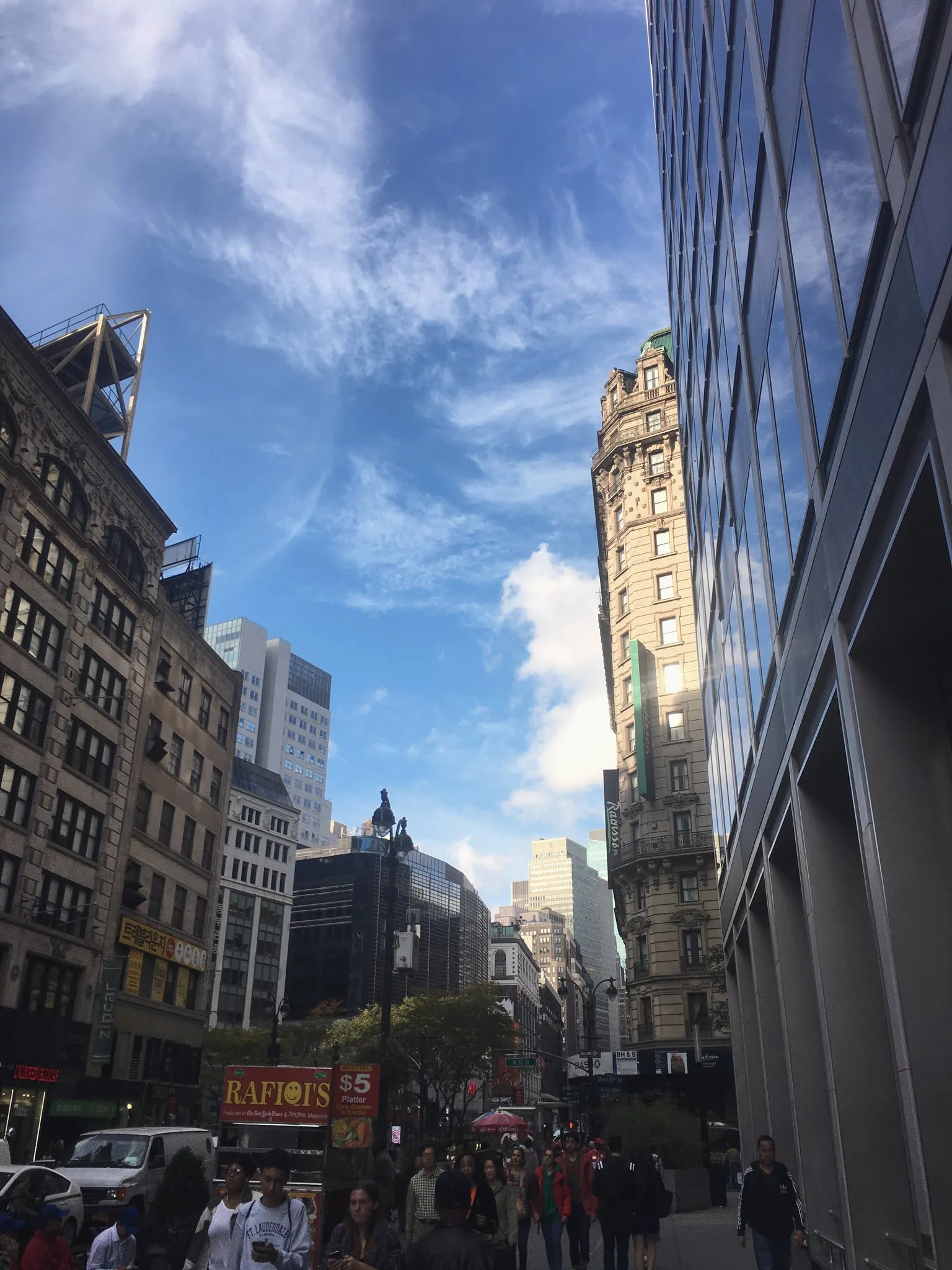 A Manhattan street in Midtown with taxis and tall buildings