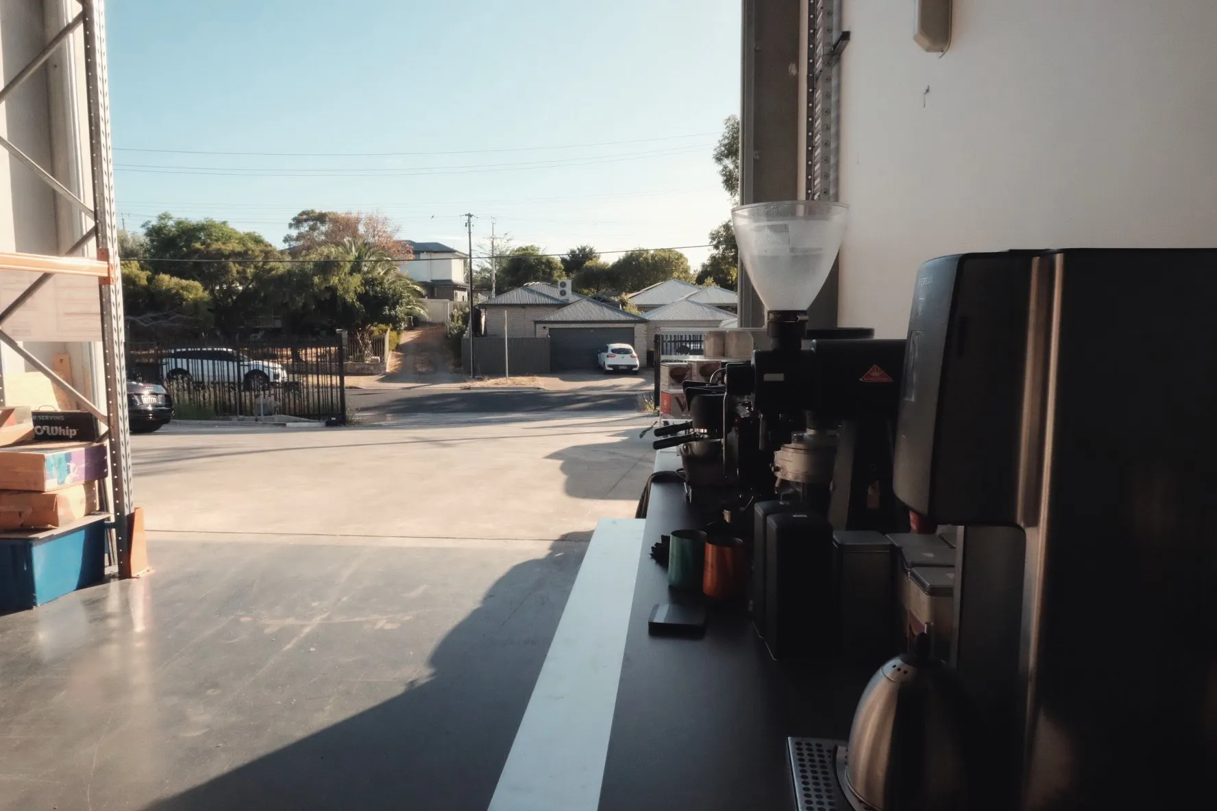 A warehouse-style coffee workspace exterior
